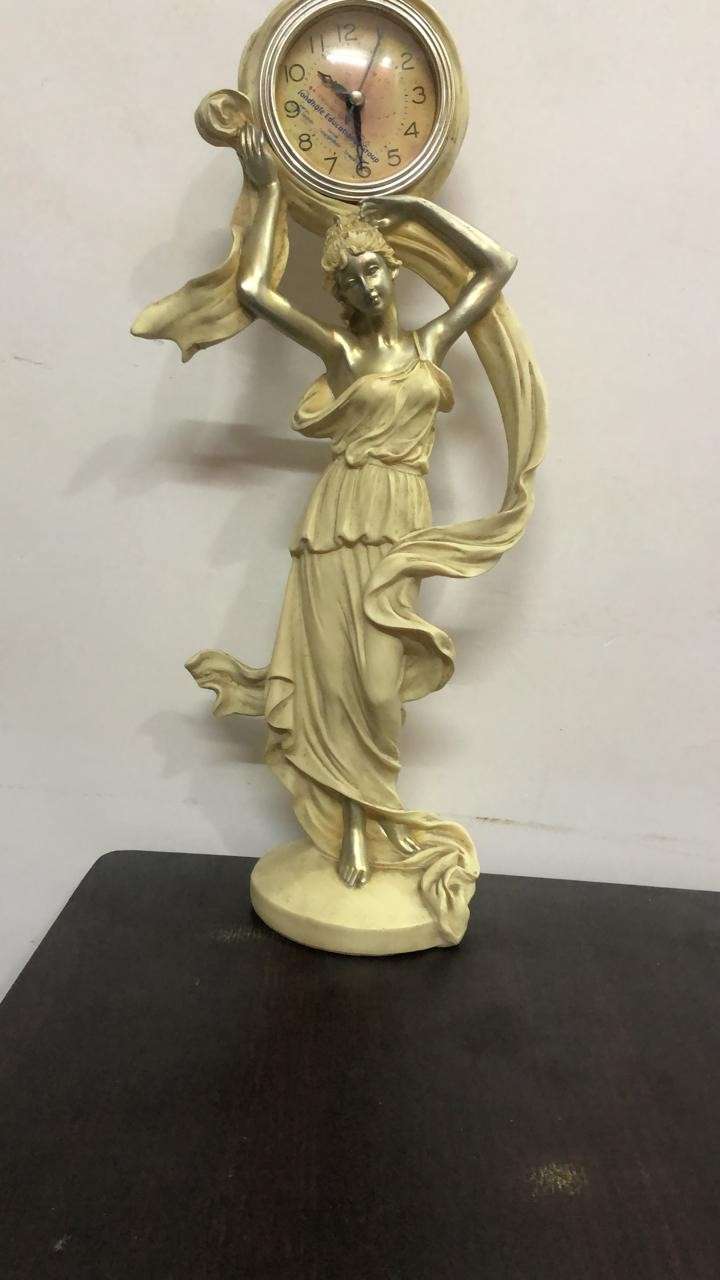 Rajani Pandit artistic woman statue with vintage clock